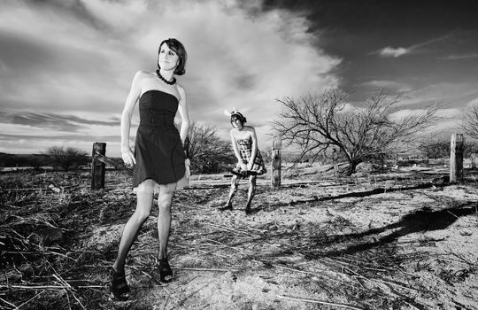 Two punk girls posing in a rural setting