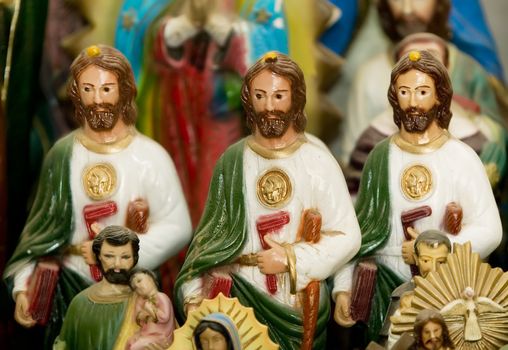 Three statues of jesus Christ on a Catholic altar.