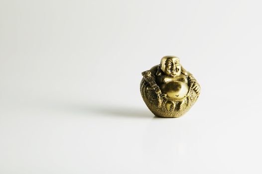 Gold Buddha Statue on a White Background