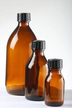 Three brown medicine bottles shot in studio