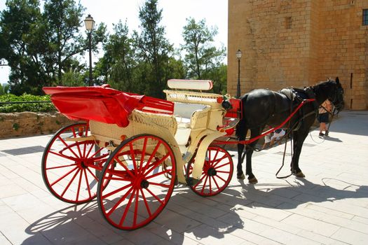 Red carriage waiting for it's customers