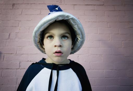 Close-up of a young boy in a wizard costume 