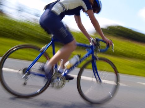 cyclist on downgrade road during a local triathlon event