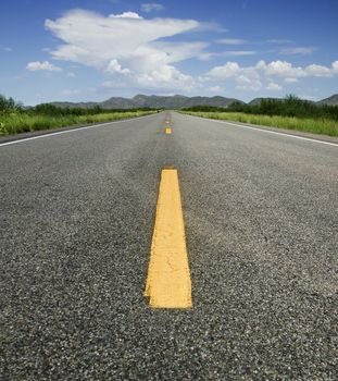 Yellow Road Stripe Points to the Horizon