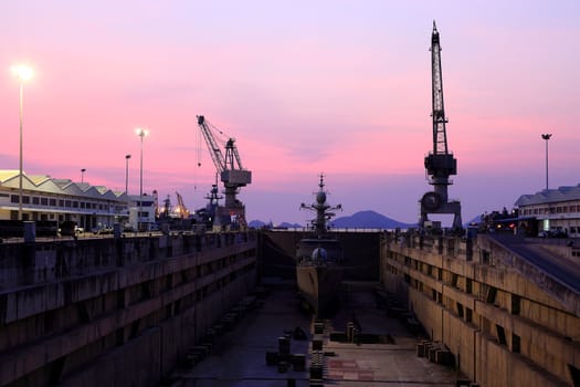 Crane near a covered dry dock at the shipyard