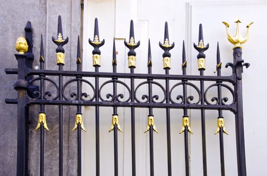 Details of metal decorative gate fragment. Luxury gold finish.