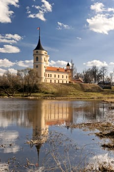 Mariental Castle with reflection in river water in an early spring day