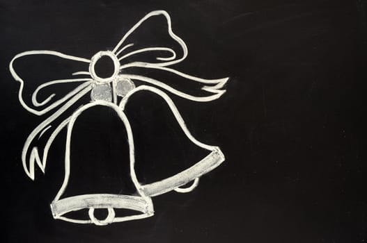Jingle bells drawn with chalk on a blackboard