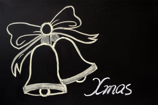 Jingle bells drawn with chalk on a blackboard