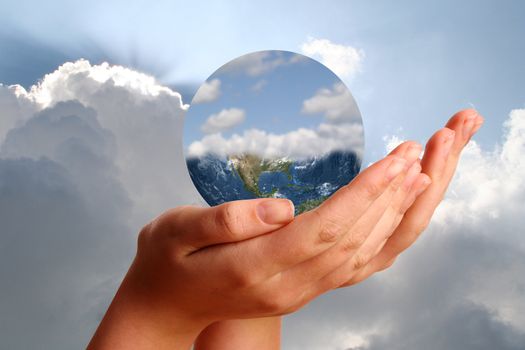 Young womans hand showing the world