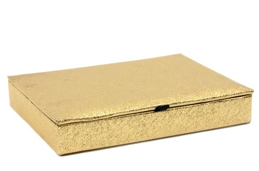 Golden shimmering gift box isolated on white background