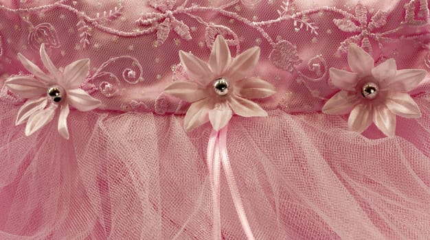 Pink flower detail, with embroidery, lace and satin background