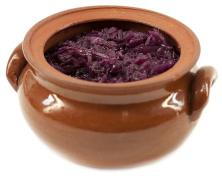 Sauerkraut from red cabbage in clay pot
