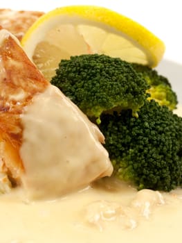 Salmon with broccoli and creamed lemon shrimp sauce