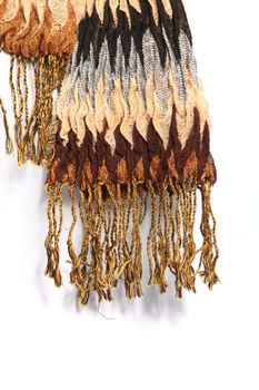 Luxurious warm soft winter scarf with tassels and a striped zig-zag pattern in browns and greys against a white background