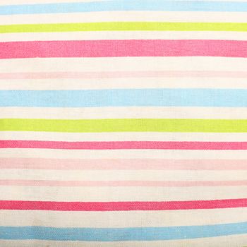 Striped linen background showing texture and weave detail with fresh pink, green and blue stripes on white
