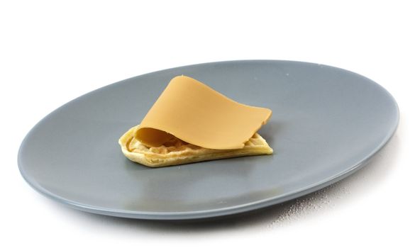 Single waffle with traditional Norwegian brown cheese on plate