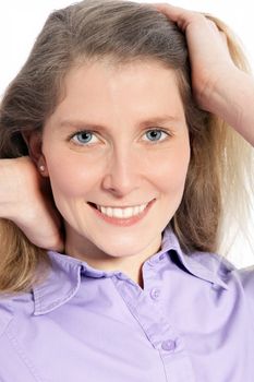 Happy mid age woman holding her hair in a close up shot