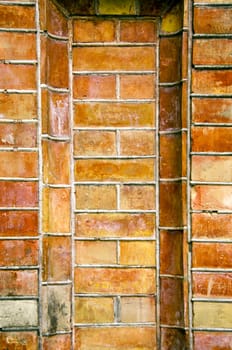 Old ancient gate made of red brick background. Architectural background.