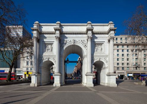 Marble Arch, London, England. Originally the front entrance to Buckingham Palace and now at the end junction of Park Lane and Oxford Street, which location is accordingly known as Marble Arch