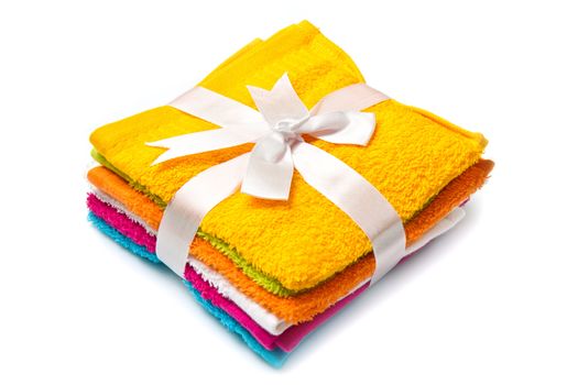 a group of colored towels on white background