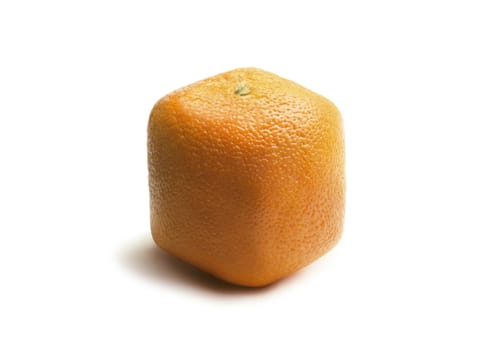 Square (cube) orange on a white surface, representing genetically modified fruit