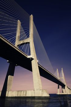 sunset on Vasco da Gama bridge in Lisbon, Portugal 