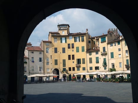 The Piazza Anfiteatro - Lucca , Italy. View from piazza Anfiteatro, former a Roman Ampitheatre, in Lucca. Tuscany, Italy.
