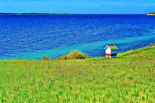 Coast seashore green meadow and soft hills Funen Denmark digital art manipulation