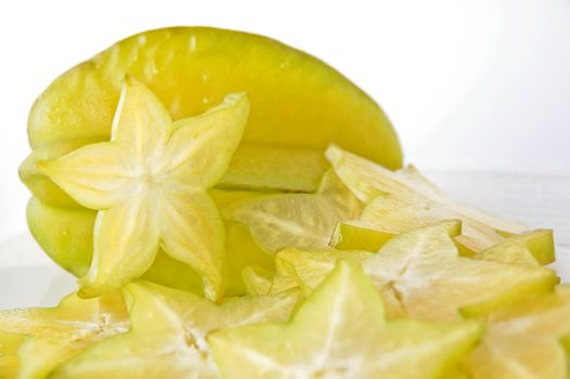 close up sliced starfruit on white background