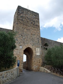 Town-walls of Monteriggioni, medieval village completely encircled from circular walls with 14 towers. Siena, Tuscany, Italy
