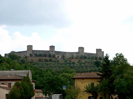 Town-walls of Monteriggioni, medieval village completely encircled from circular walls with 14 towers. Siena, Tuscany, Italy
