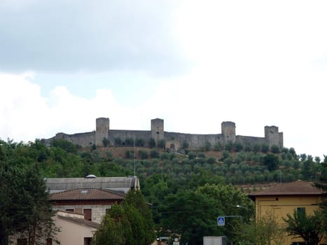 Town-walls of Monteriggioni, medieval village completely encircled from circular walls with 14 towers. Siena, Tuscany, Italy
