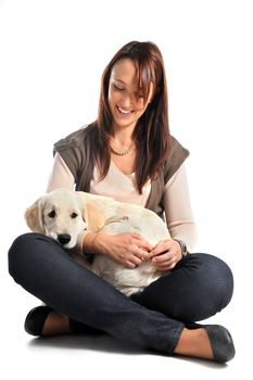 puppy golden retriever and woman in front of a white background