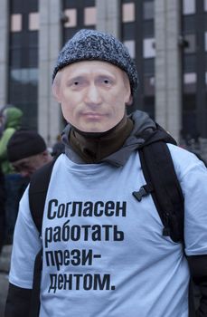 MOSCOW - DECEMBER 24: The protester with Putin's mask on his face and inscription on his t-shirt: "I am ready to work as a President". The biggest protest in Russia for the last 20 years. 