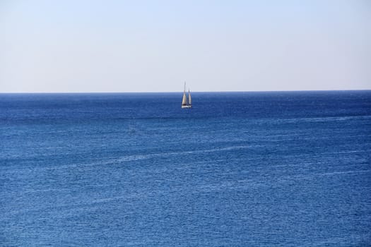Image of calm breeze ocean and white yacht