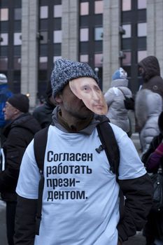 MOSCOW - DECEMBER 24: The protester with Putin's mask on his face and inscription on his t-shirt: "I am ready to work as a President". The biggest protest in Russia for the last 20 years. 