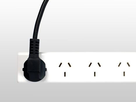 A power cord used conceptually on a white background