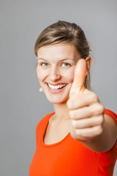 An image of a young woman with a thumb up