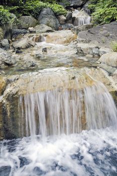 fresh scenic water cascade in summer forest