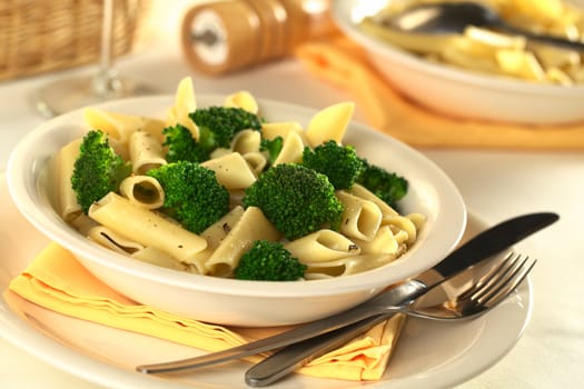Broccoli with pasta (Selective Focus, Focus one third into the meal on the front of the two broccoli florets) 