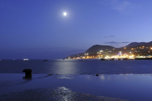 moon rising over Black sea in place of Alushta city in Crimea, Ukraine