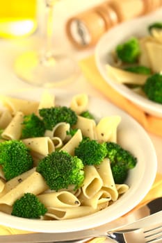 Broccoli with pasta (Selective Focus, Focus on the broccoli floret one third into the dish)