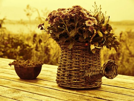 Beautiful still life basket of flowers on a wooden table digital art manipulated