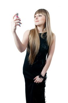 The beautiful girl in black dress isolated on white