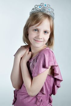 little princess in purple dress isolated on white