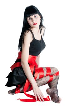 Sexy women in black dress rolled up by a red ribbon