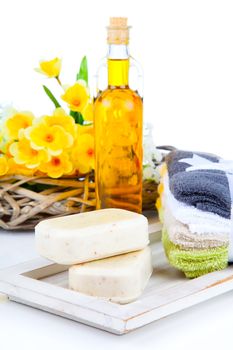 two bars of soap and toiletries for relaxation, isolated on white background