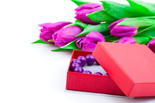 bangles in the gift box and tulips on isolated background