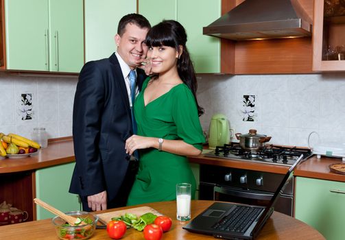 Portrait of a Happy couple preparing food in the kitchen